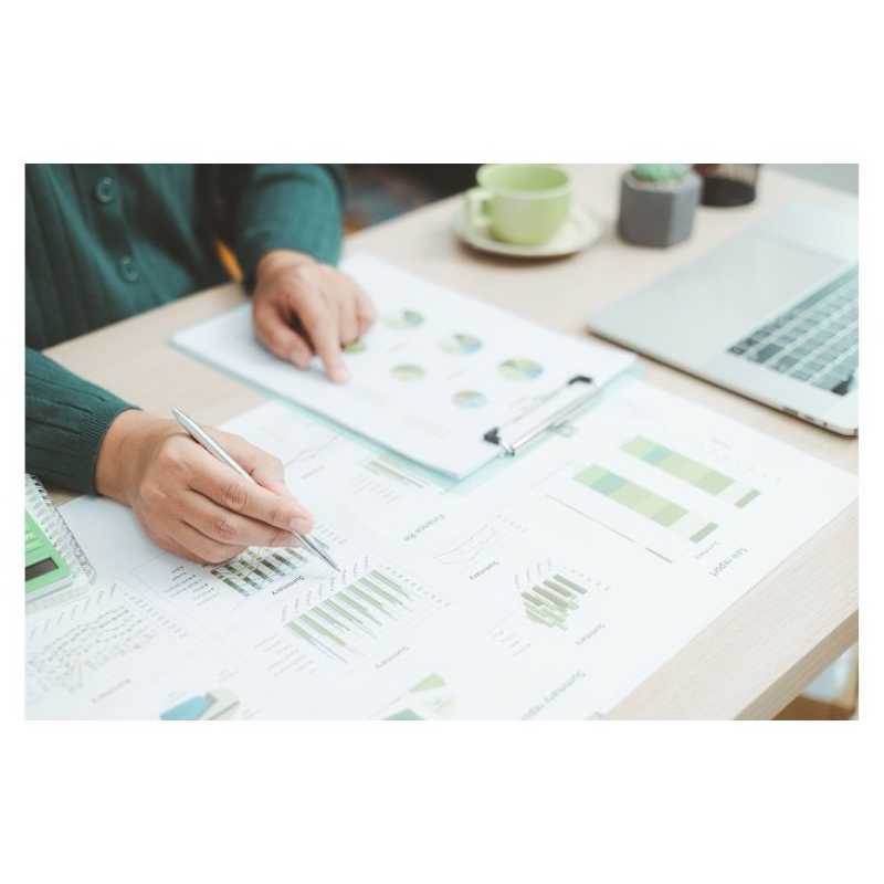 Picture of man working on desk with pen and paper
